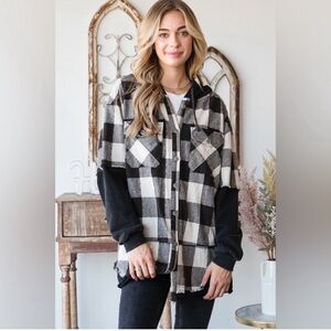 Dressed in LaLa brand hooded flannel. Black and white.